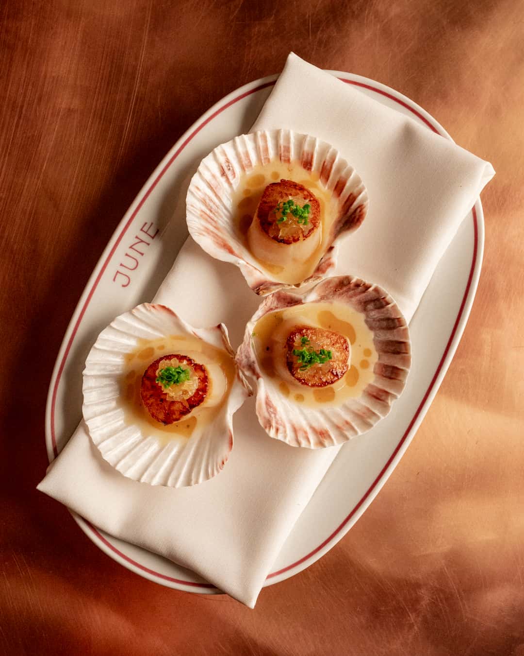 Roasted Scallop recipe served on a plate, by June