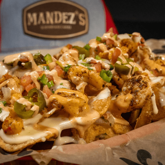 Seafood Nachos recipe served on a plate, by Mandez's Seafood Bar & Grill