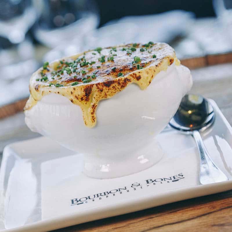 French Onion Soup recipe served on a plate, by Bourbon & Bones Chophouse | Bar French Onion Soup recipe served on a plate, by Bourbon & Bones Chophouse | Bar