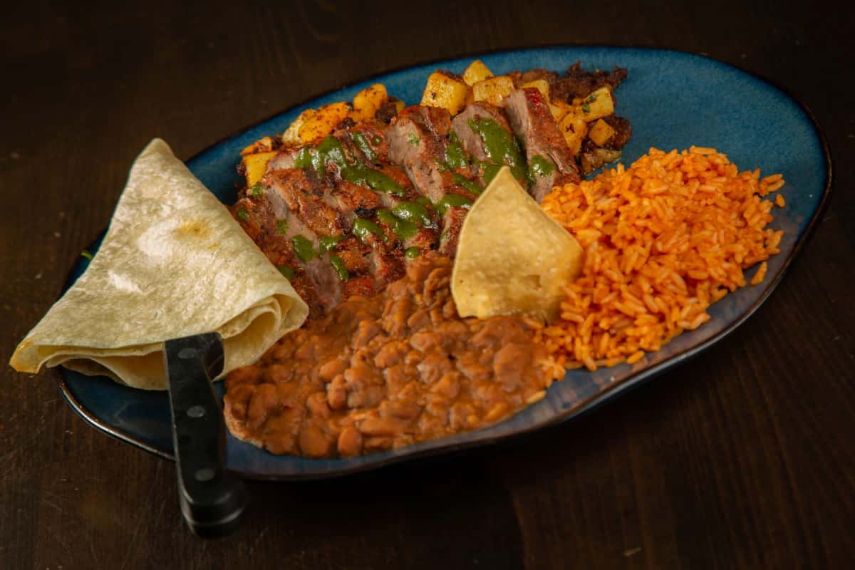 Carne Asada recipe served on a plate, by Hussong’s Cantina Henderson Carne Asada recipe served on a plate, by Hussong’s Cantina Henderson