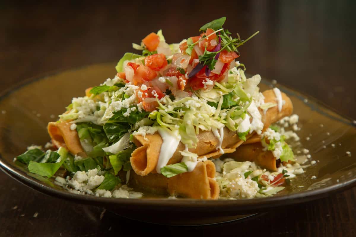 Taquitos recipe served on a plate, by Hussong’s Cantina Henderson Taquitos recipe served on a plate, by Hussong’s Cantina Henderson