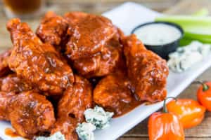 Sauced Wings recipe served on a plate, by Island Wing Company Grill & Bar - Tamaya Sauced Wings recipe served on a plate, by Island Wing Company Grill & Bar - Tamaya